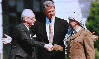 Chairman Y. Arafat and PM Itzhak Rabin after signing the Oslo Agreement
